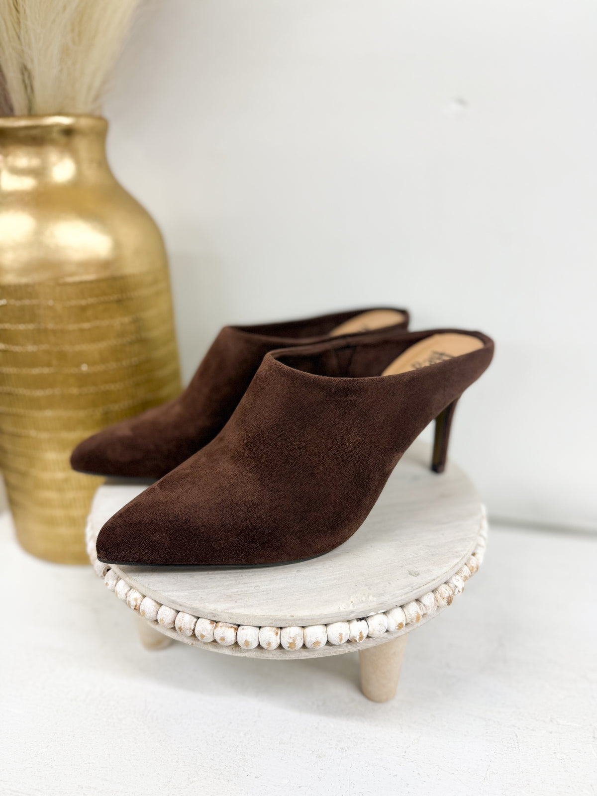Chocolate suede slip-on mule with pointed toe, kitten heel, and beaded sole