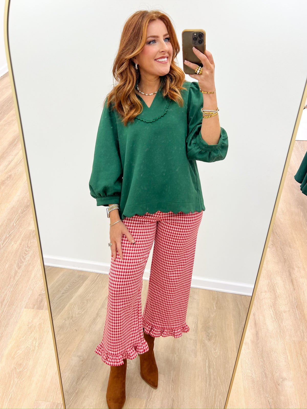 Hunter green puff sleeve blouse with scalloped notched V-neckline