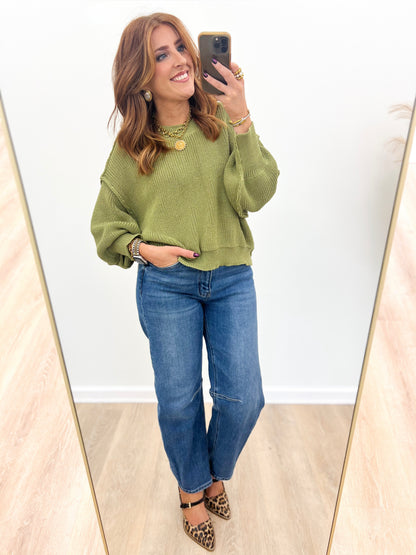 Olive oversized mock-neck sweater with ribbed cuffs and hem