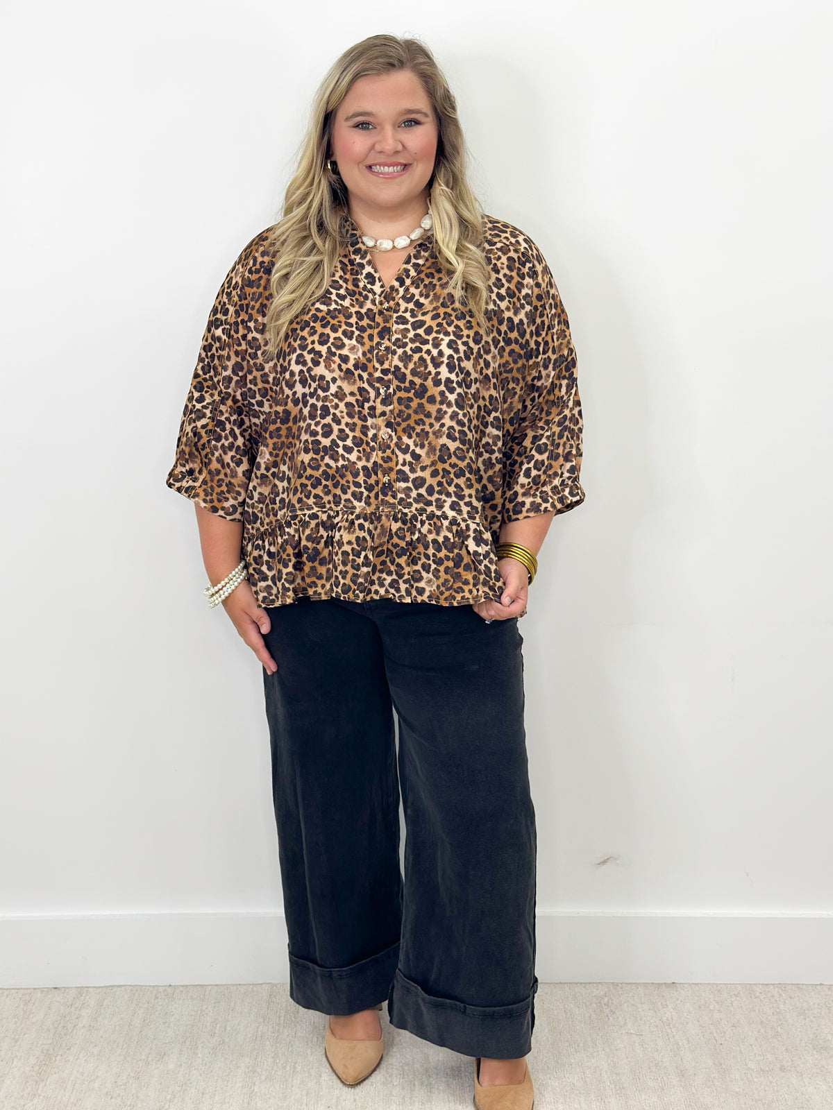 Curvy leopard print button-down top with frilled hem and short sleeves