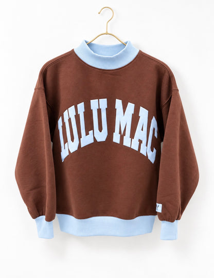 Brown puff mock neck sweatshirt with light blue rib trim and white 'LuLu Mac' print