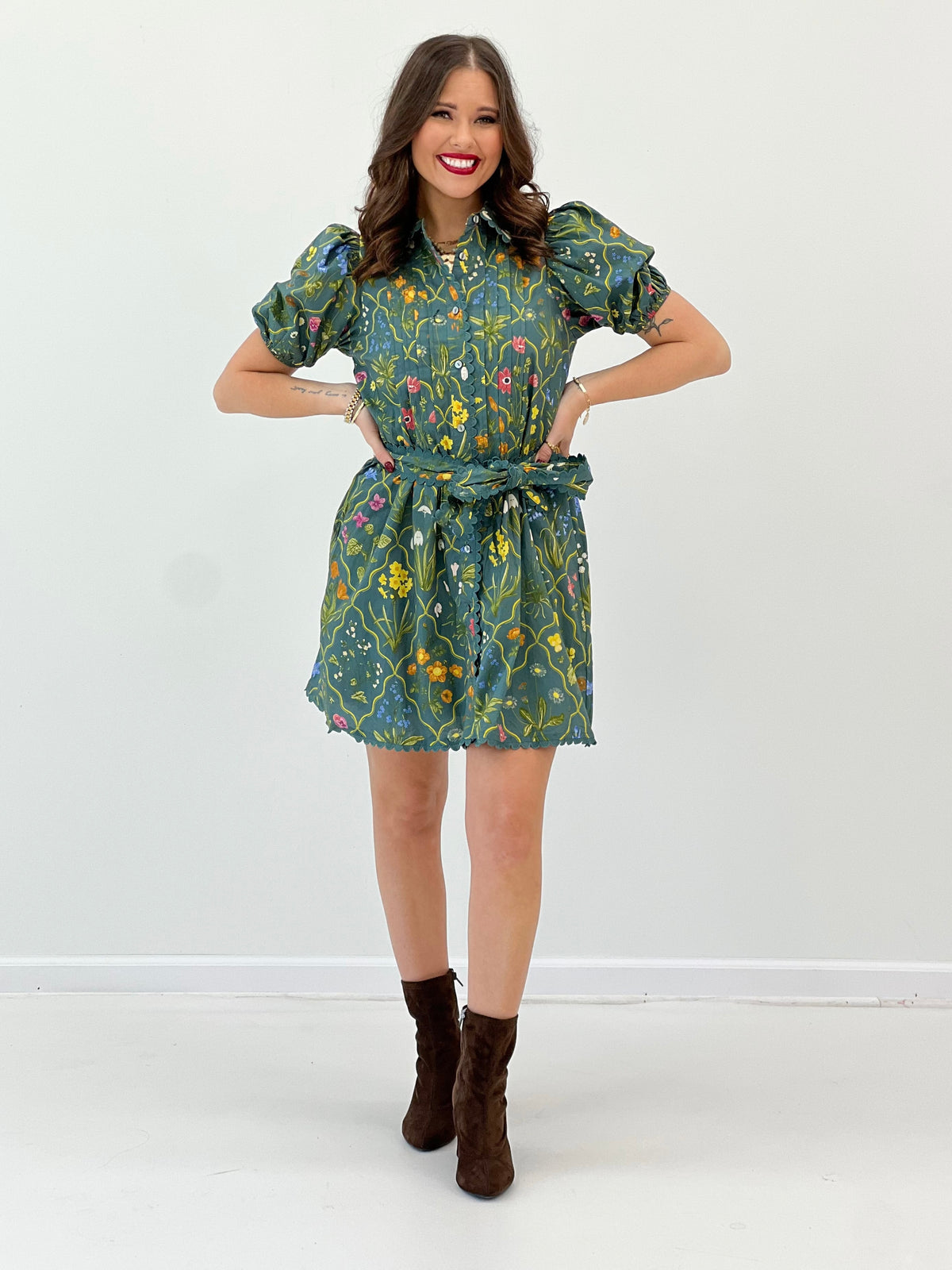 Teal floral mini dress with puff sleeves, ruffle-like gathered skirt and scalloped trim