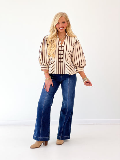 Brown-and-cream striped puff-sleeve blouse with embroidered center placket
