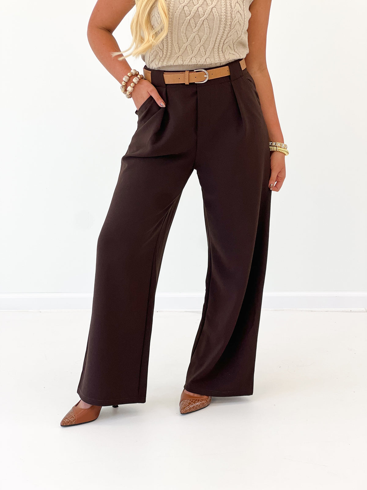 Dark brown belted pleated wide-leg pants with front pleats and wide straight legs