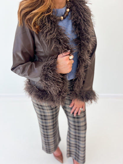 Faux fur-trim vegan leather jacket with shaggy cuffs and open front detail