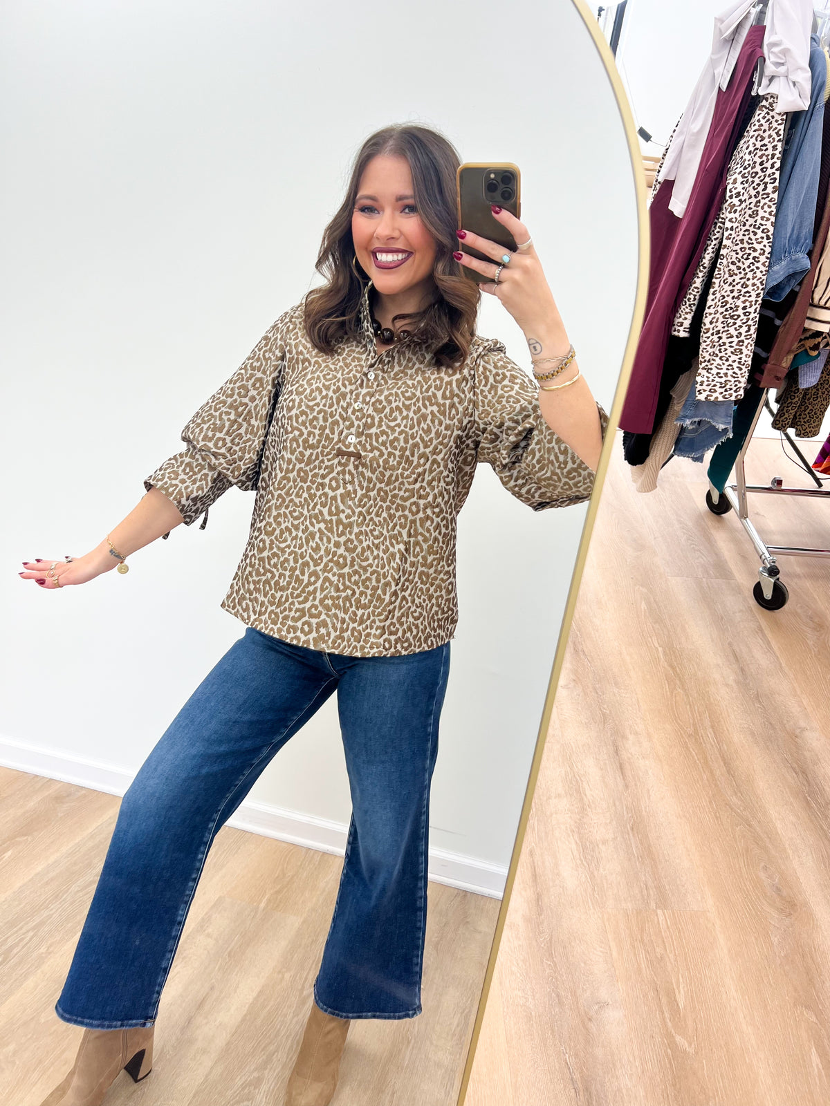 Taupe leopard jacquard button-up puff-sleeve top with tied sleeve cuffs.