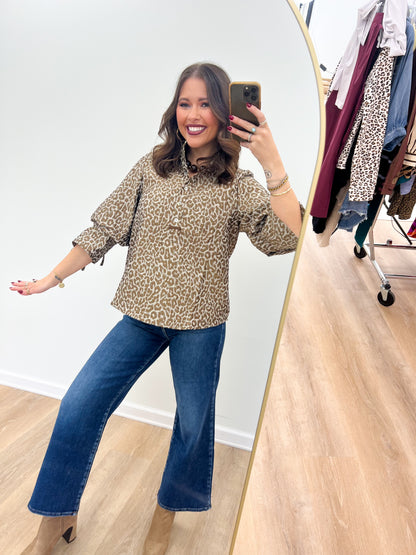 Taupe leopard jacquard button-up puff-sleeve top with tied sleeve cuffs.