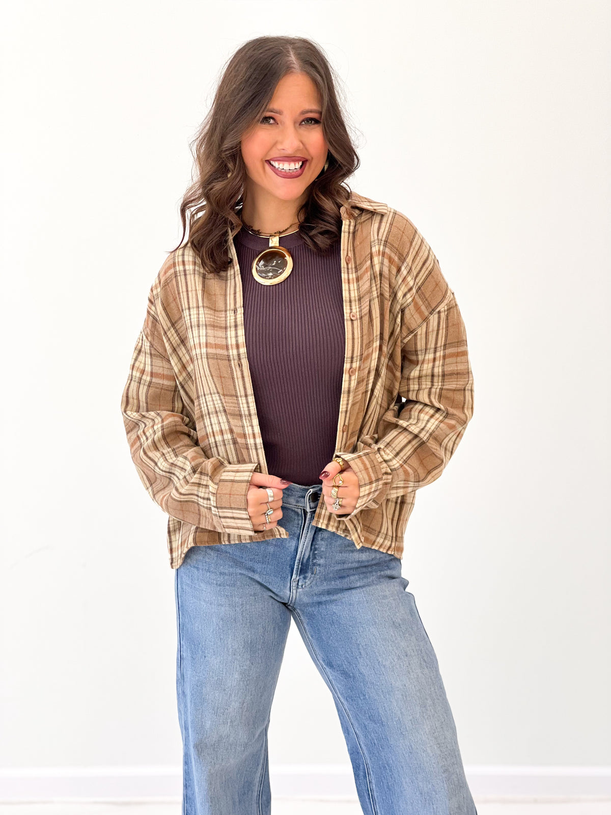 Mocha plaid button-up shirt close-up, front buttons and pointed collar
