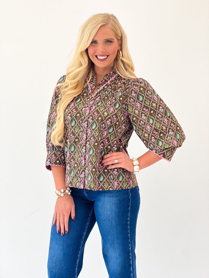 Brown patterned button-down top with ruffle collar and 3/4 puff sleeves