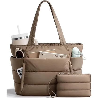Dark khaki puffer tote bag with front pocket, long padded handles, side pockets, and matching zip pouch