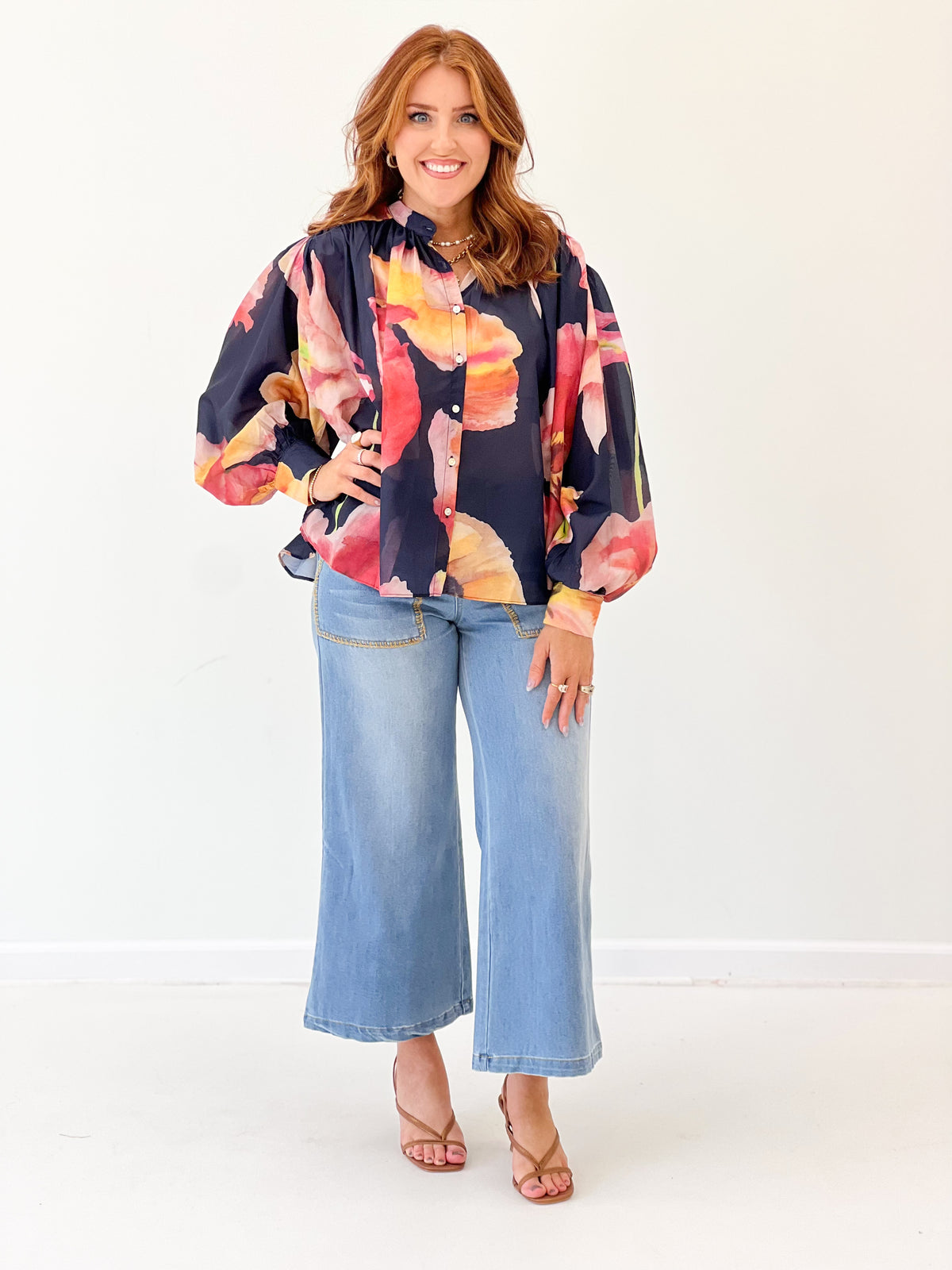 Navy floral print blouse with loose fit, batwing sleeves and button front