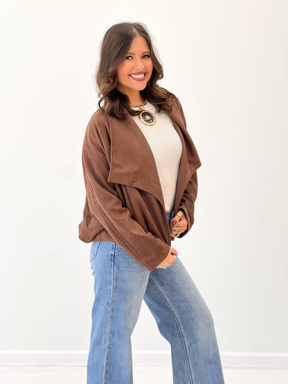 Brown suede collared jacket with open front and relaxed loose sleeves