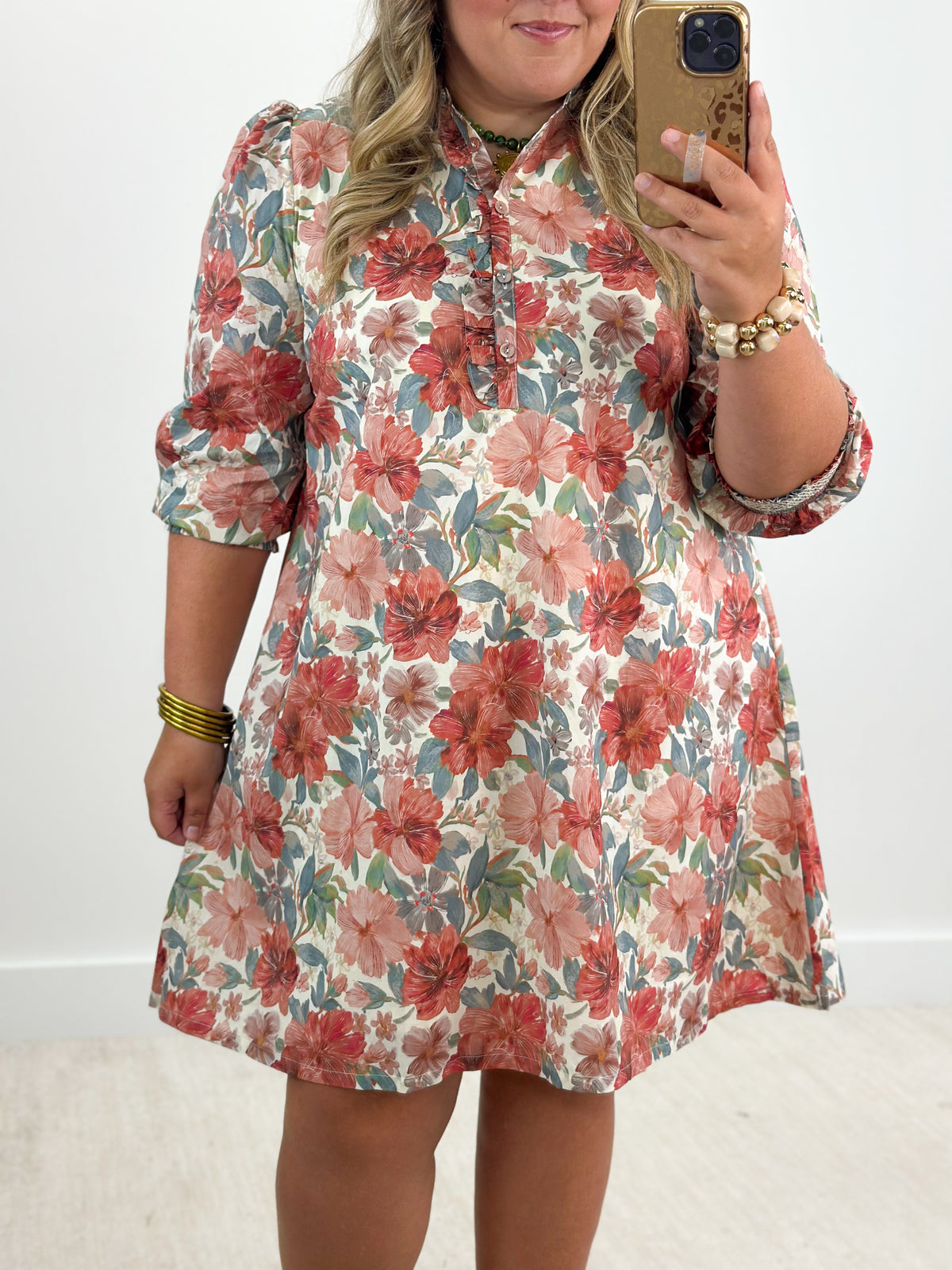 Floral button-front mini dress with smocked cuffs and puff sleeves, rust mix tones