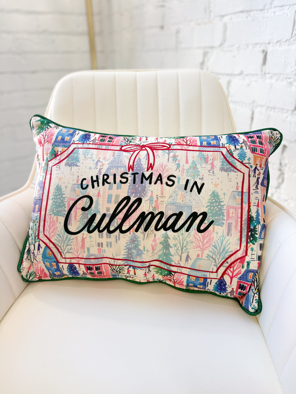 Christmas-themed throw pillow with 'CHRISTMAS IN Cullman' lettering and multicolor print