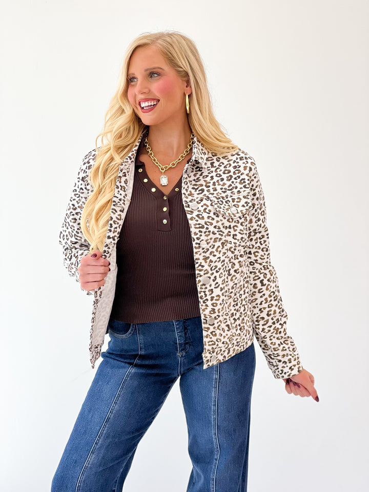 Cream leopard-print oversized jacket with collared long sleeves, open front, close-up view