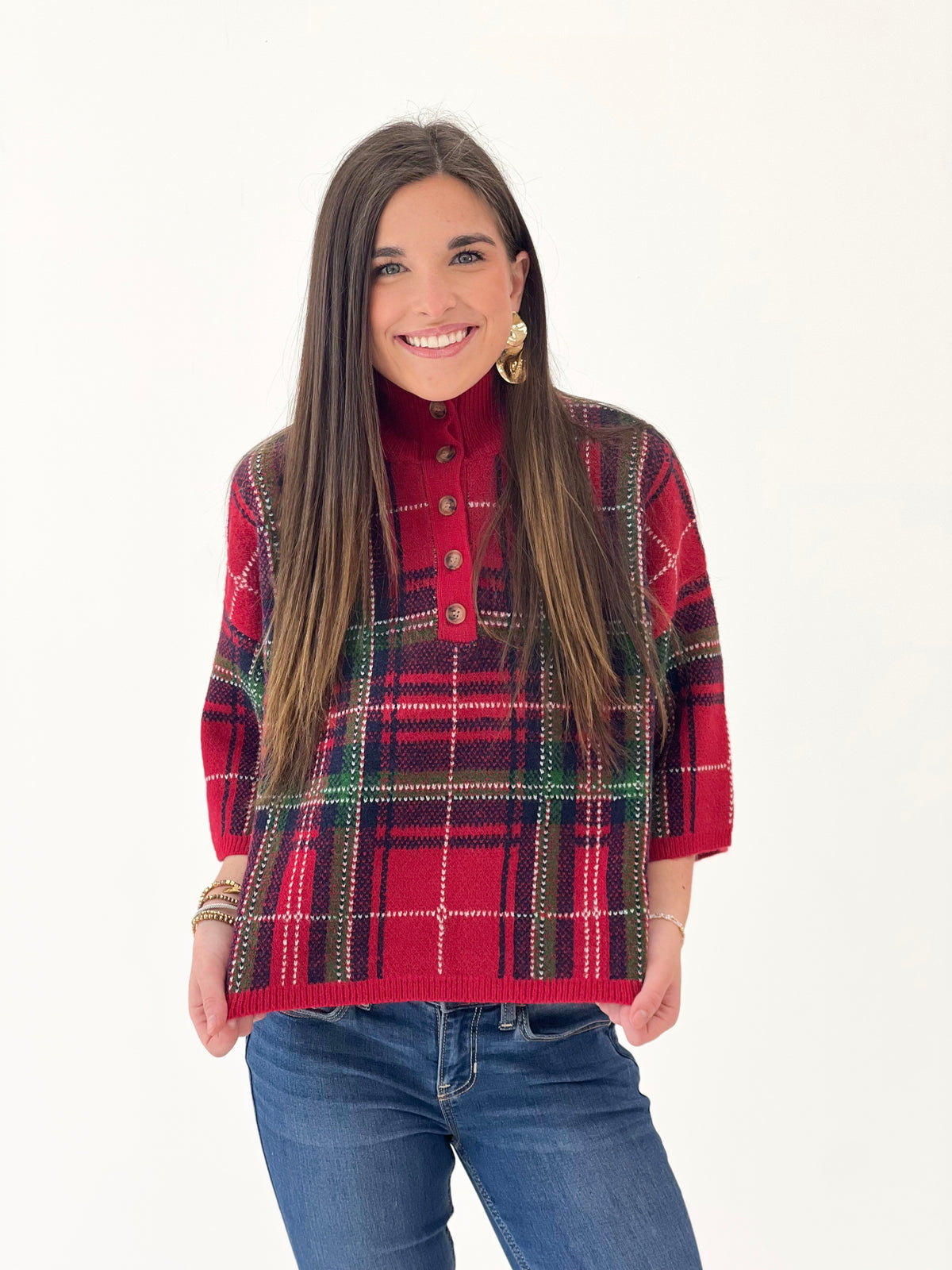 Red plaid sweater top with stand collar and decorative buttons, front view