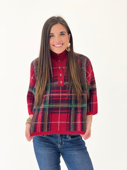 Red plaid sweater top with stand collar and decorative buttons, front view