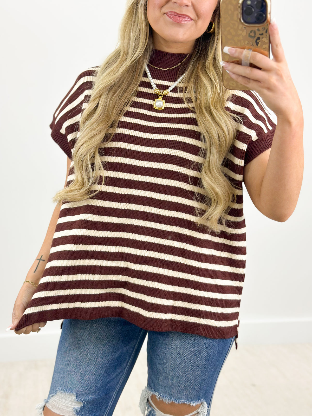Close-up burgundy and white striped mock neck sweater, ribbed neckline, short sleeve