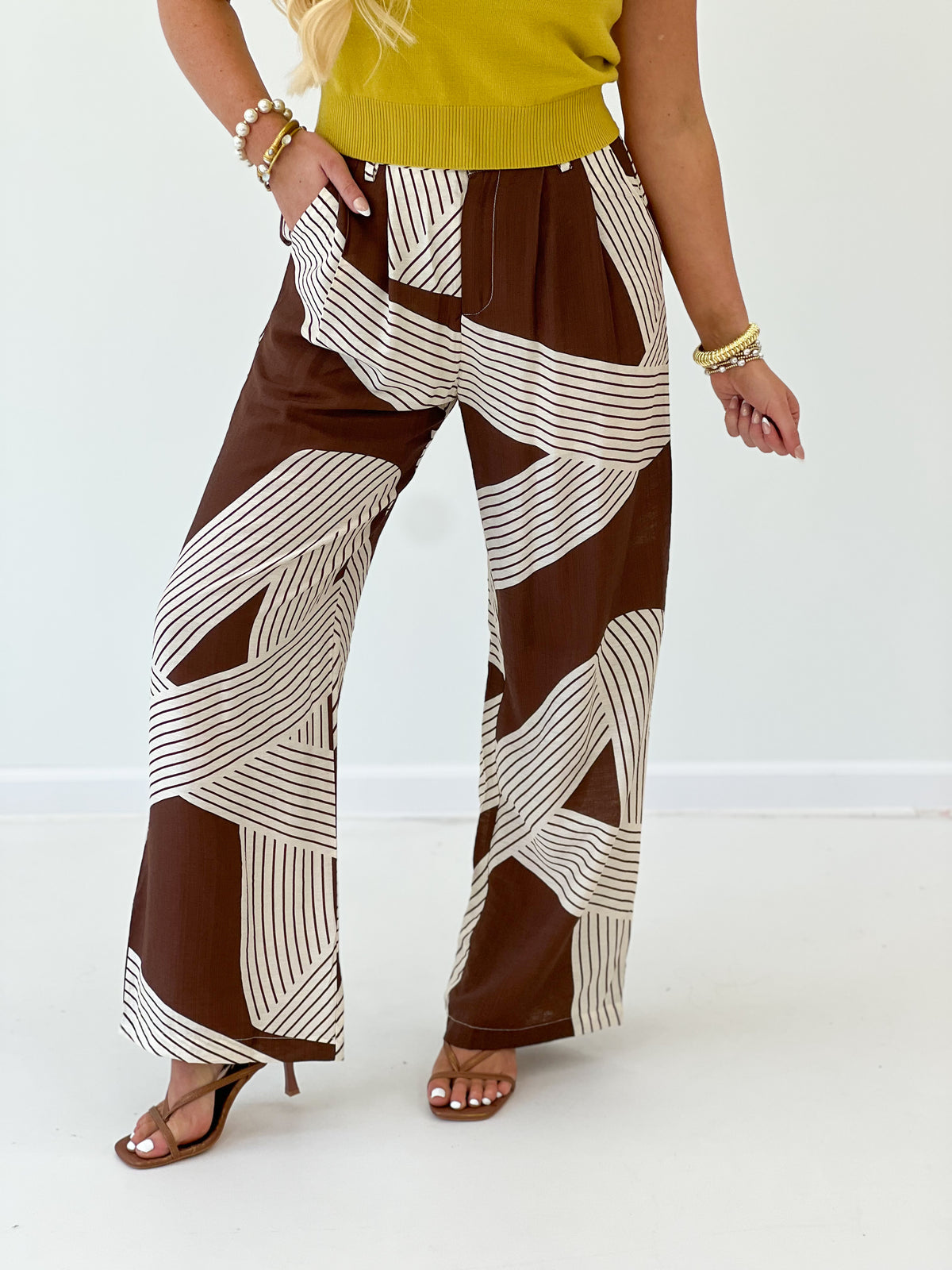 Brown and white stripe wide-leg pants with elastic waist and relaxed fit