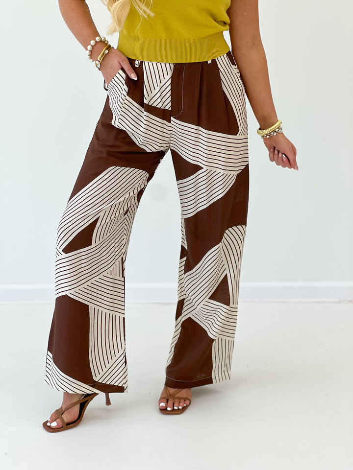 Brown and white stripe wide-leg pants with elastic waist and relaxed fit