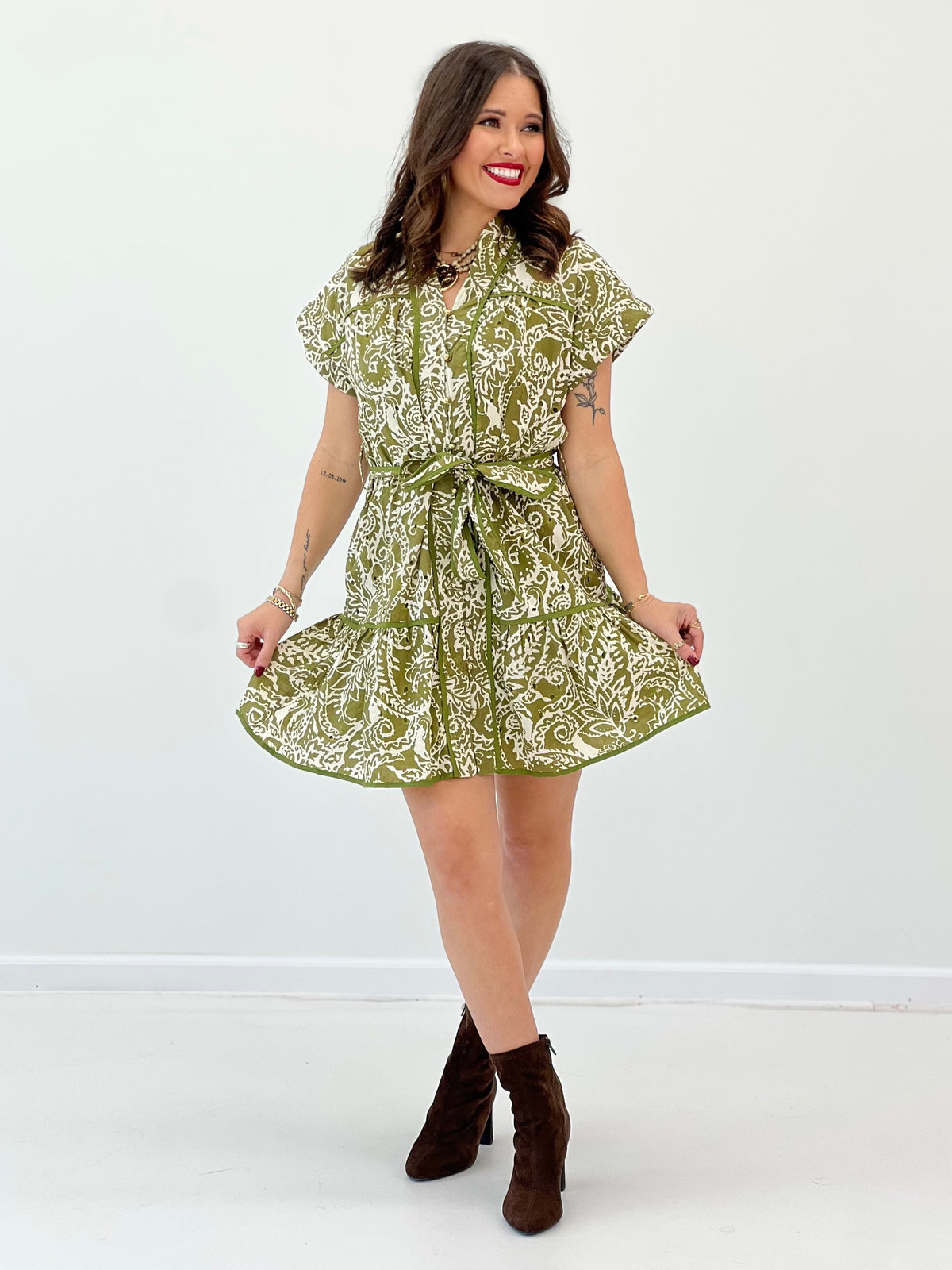 Olive printed tiered shirt mini dress with tied waist belt and ruffled tiers