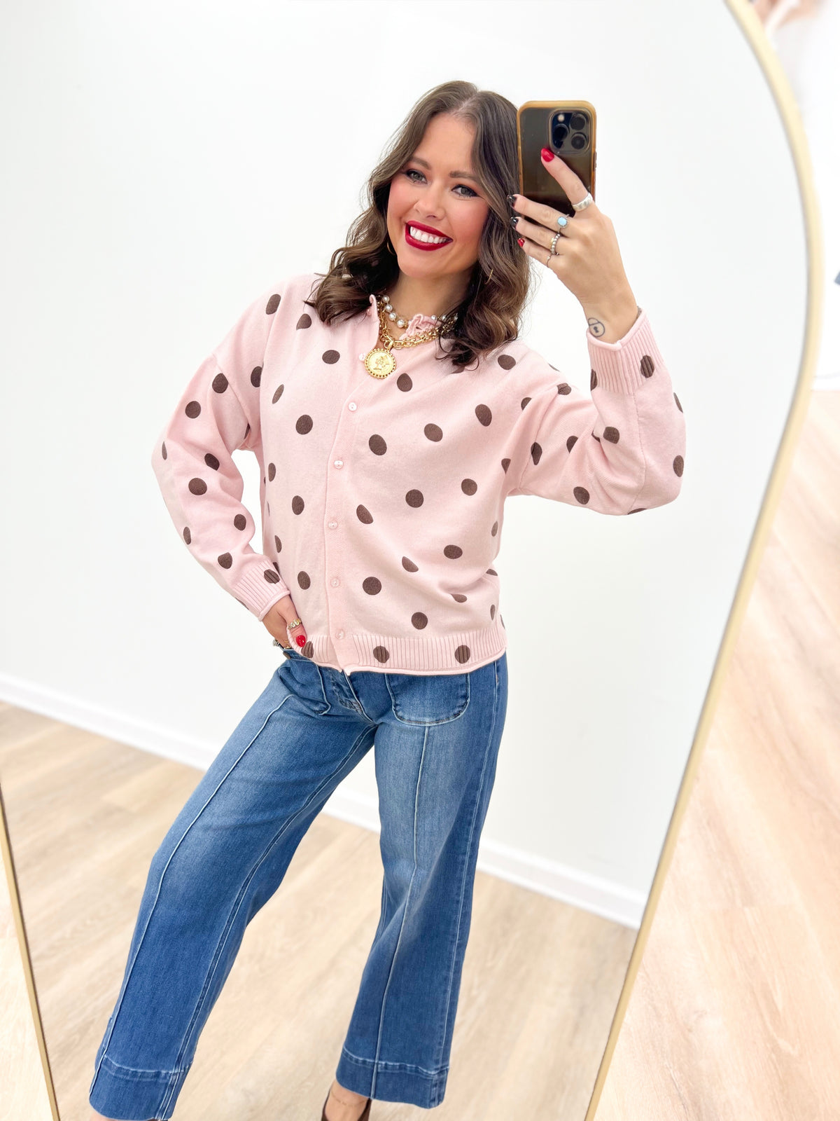 Polka dot knit cardigan, pink sweater with long sleeves and button-front closure