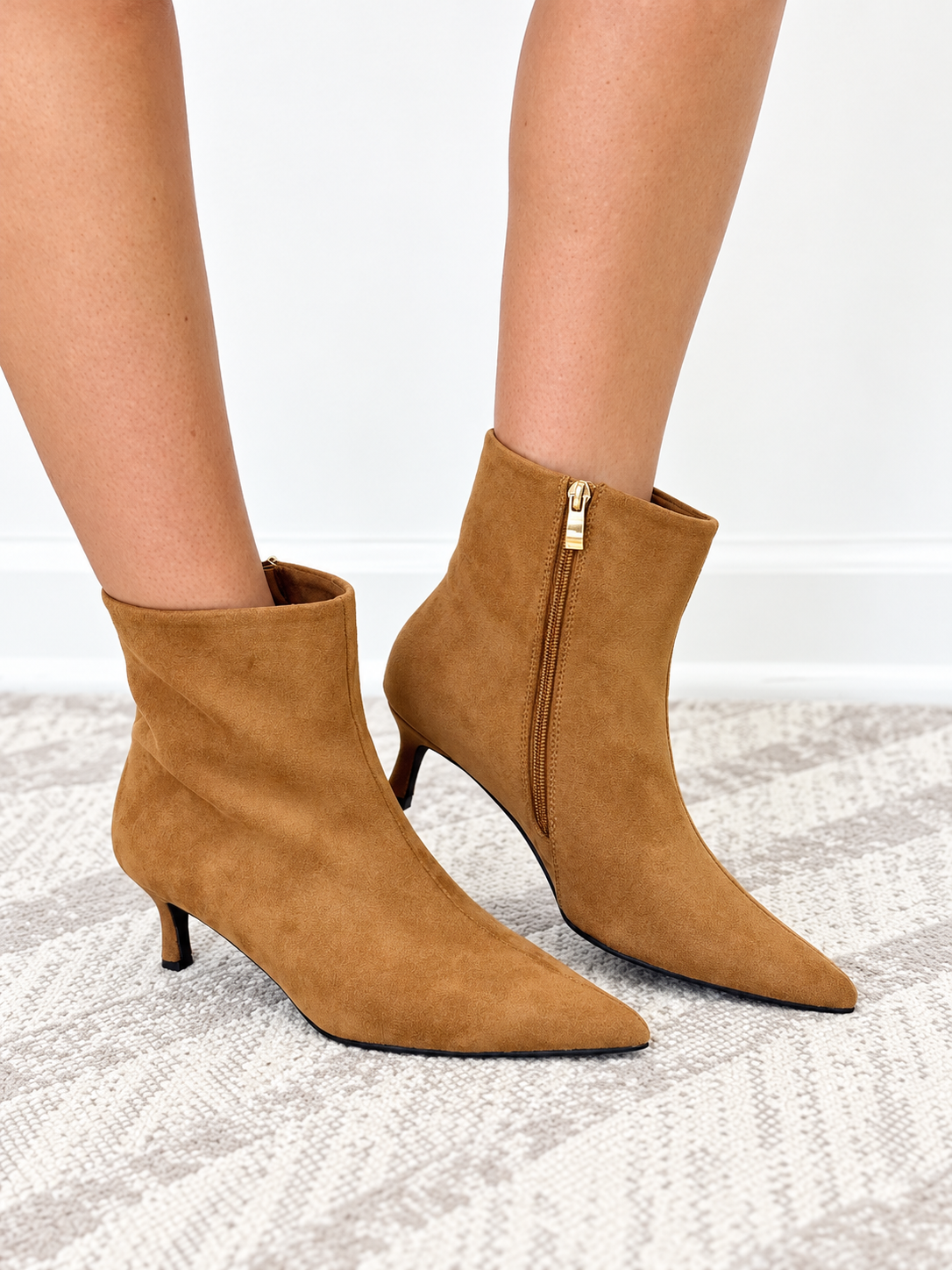 Camel suede ankle boots with side zipper, stacked heel and pointed toe, front view