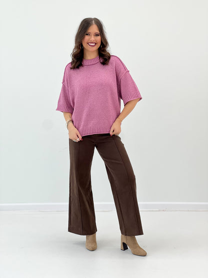 Pink metallic lurex sweater with mock neck, ribbed cuffs, and loose short sleeves