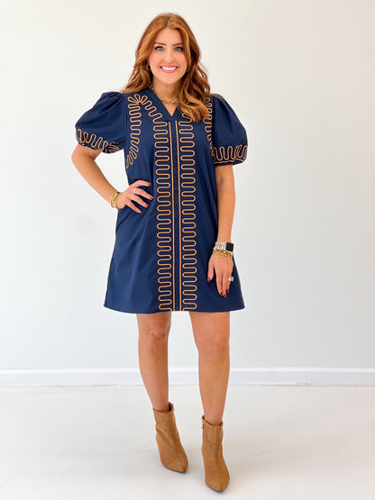 Navy short-sleeve embroidered shift dress with bold red vertical and side stripe design