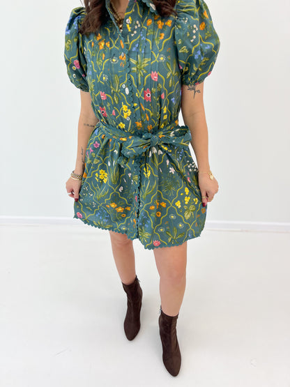 Teal floral mini dress with puff sleeves and scallop trim, tied waist