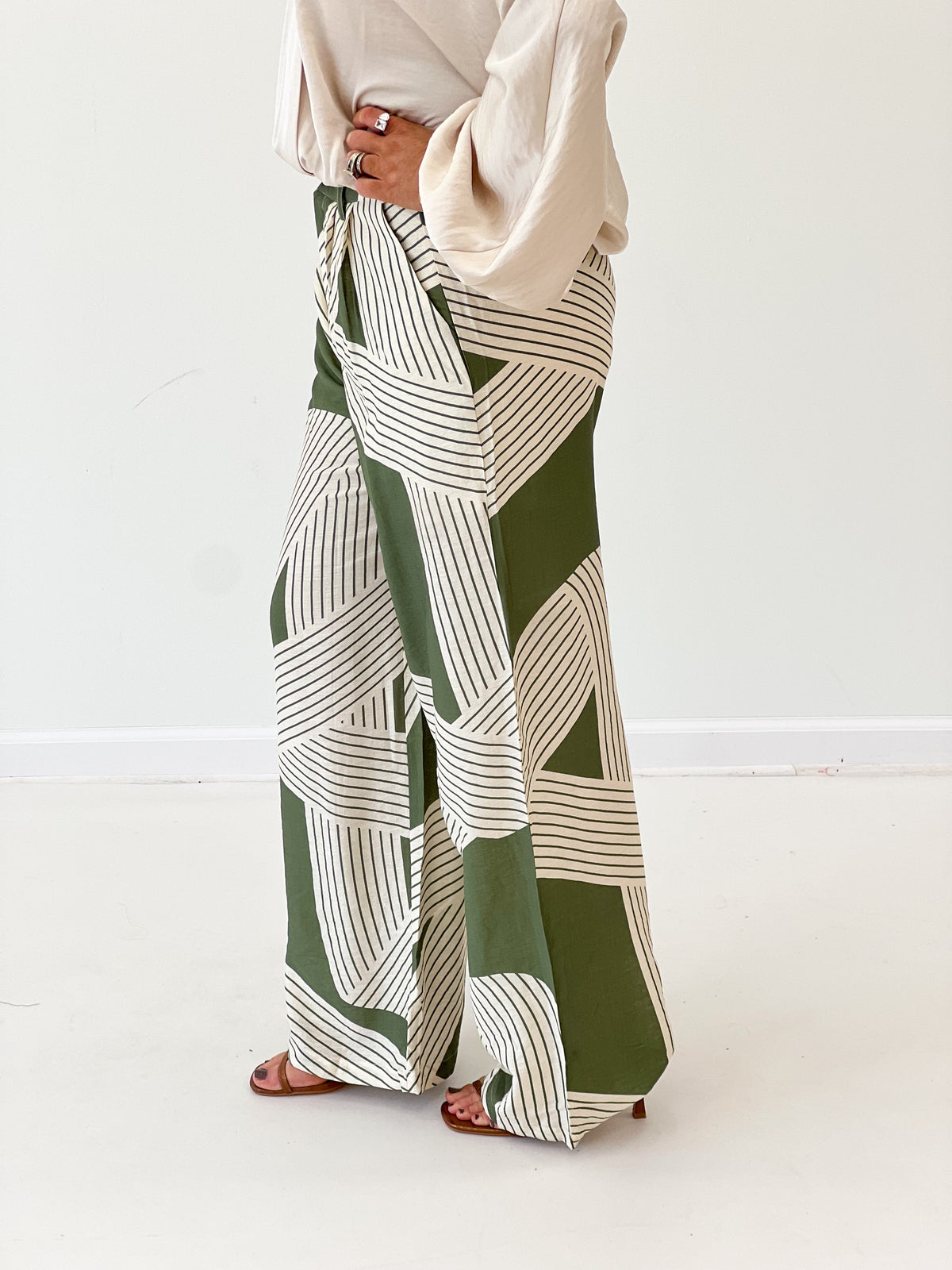 Olive and white striped wide-leg pants with elastic waist, loose fit