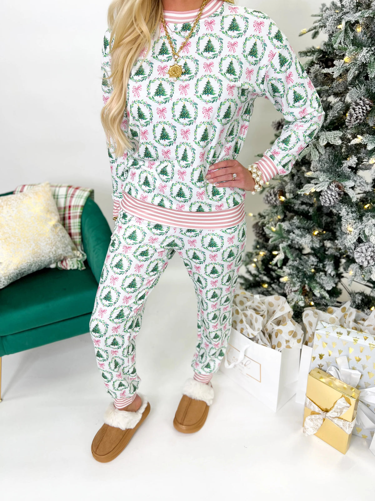 Green Christmas pajama set with pink trim, festive pattern top and matching pants