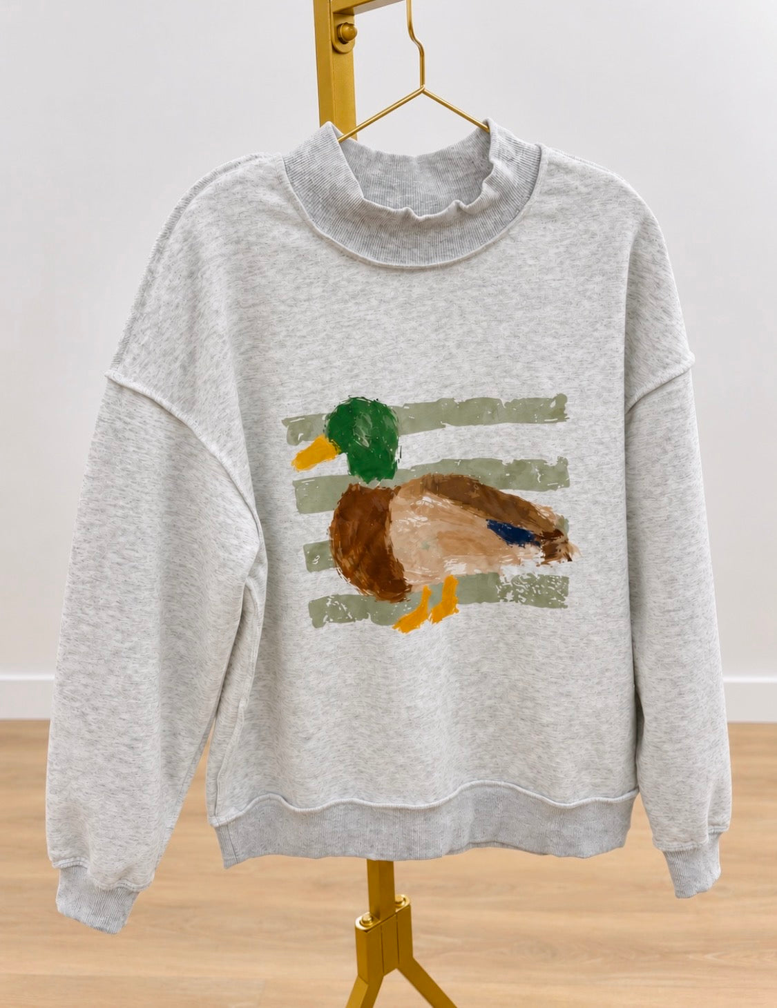 Light gray mock neck sweatshirt with green-and-brown duck chest graphic