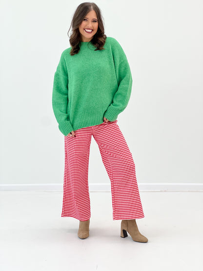 Green ribbed crew neck sweater, rounded collar and drop-shoulder sleeves