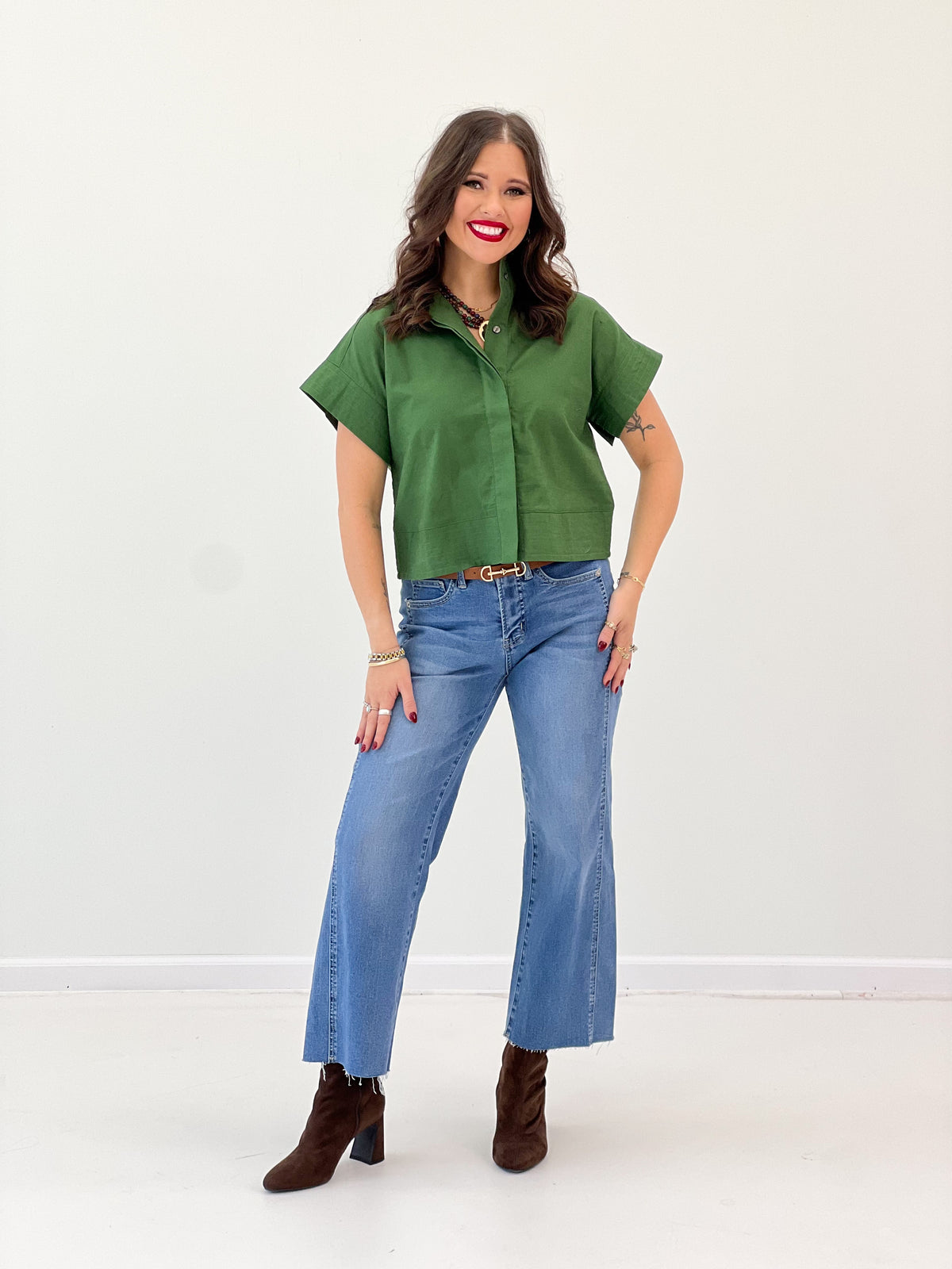 Green solid high-collar short-sleeve button-up top, front view with collar