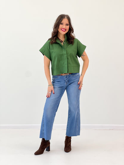 Green solid high-collar short-sleeve button-up top, front view with collar
