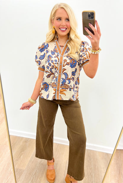 Printed short-sleeve top with puff sleeves and blue floral scroll print on off-white