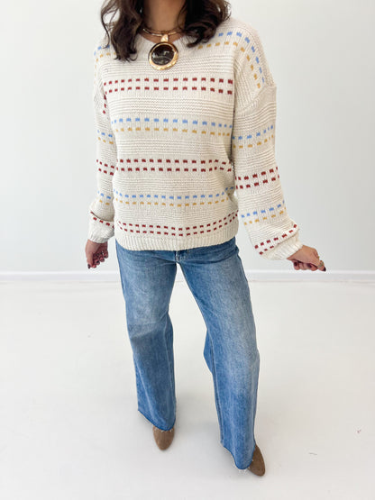 Cream striped sweater knit with multicolor bands, round crew neck, long sleeves