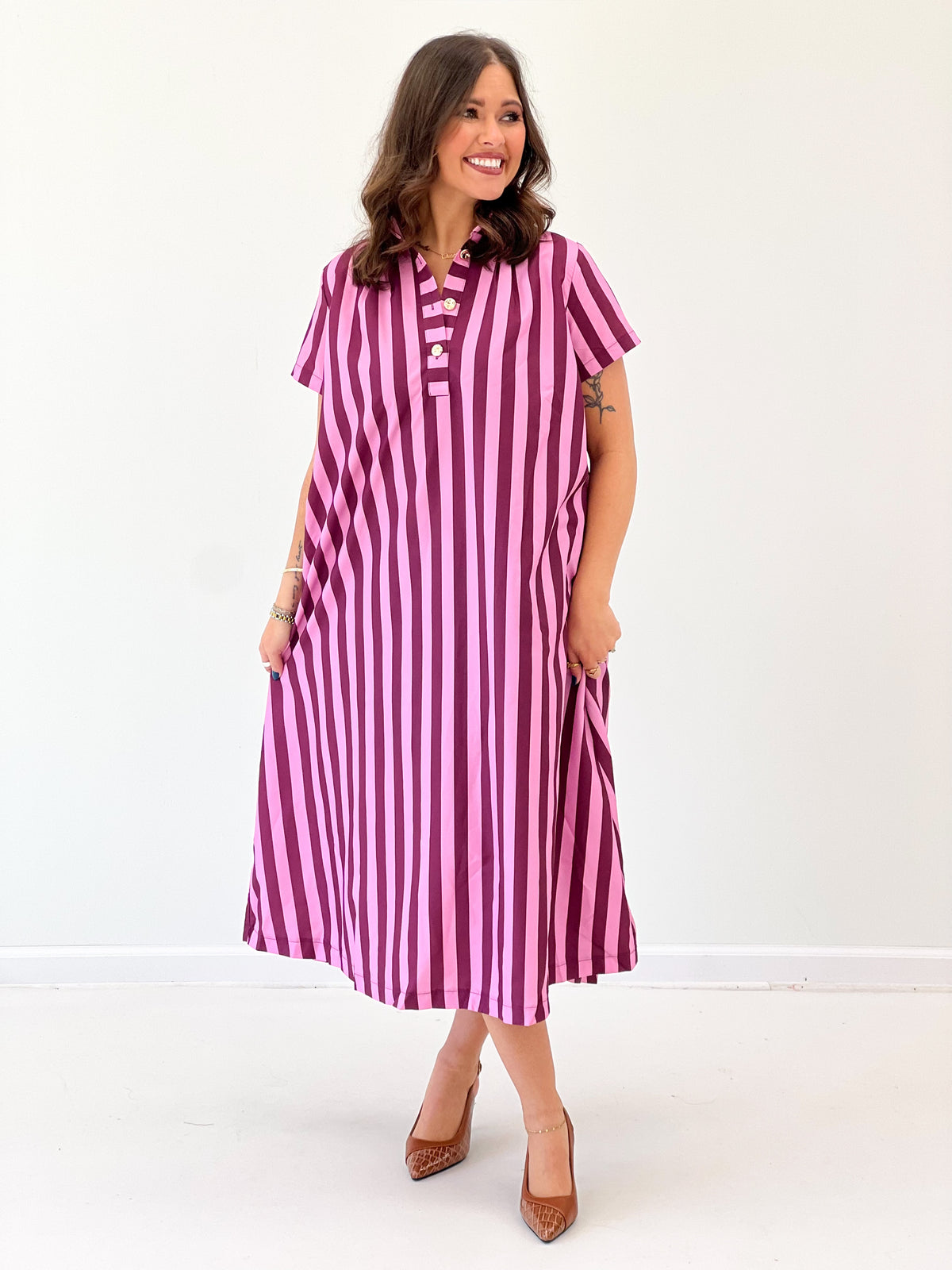 Pink striped midi dress with high neck, button placket, and short sleeves