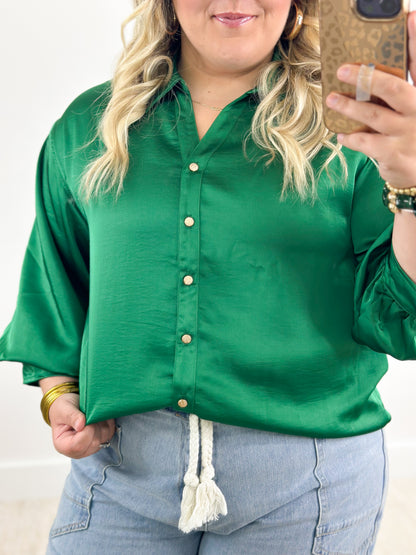 Green button-front shirt with puff sleeves and gold-button placket