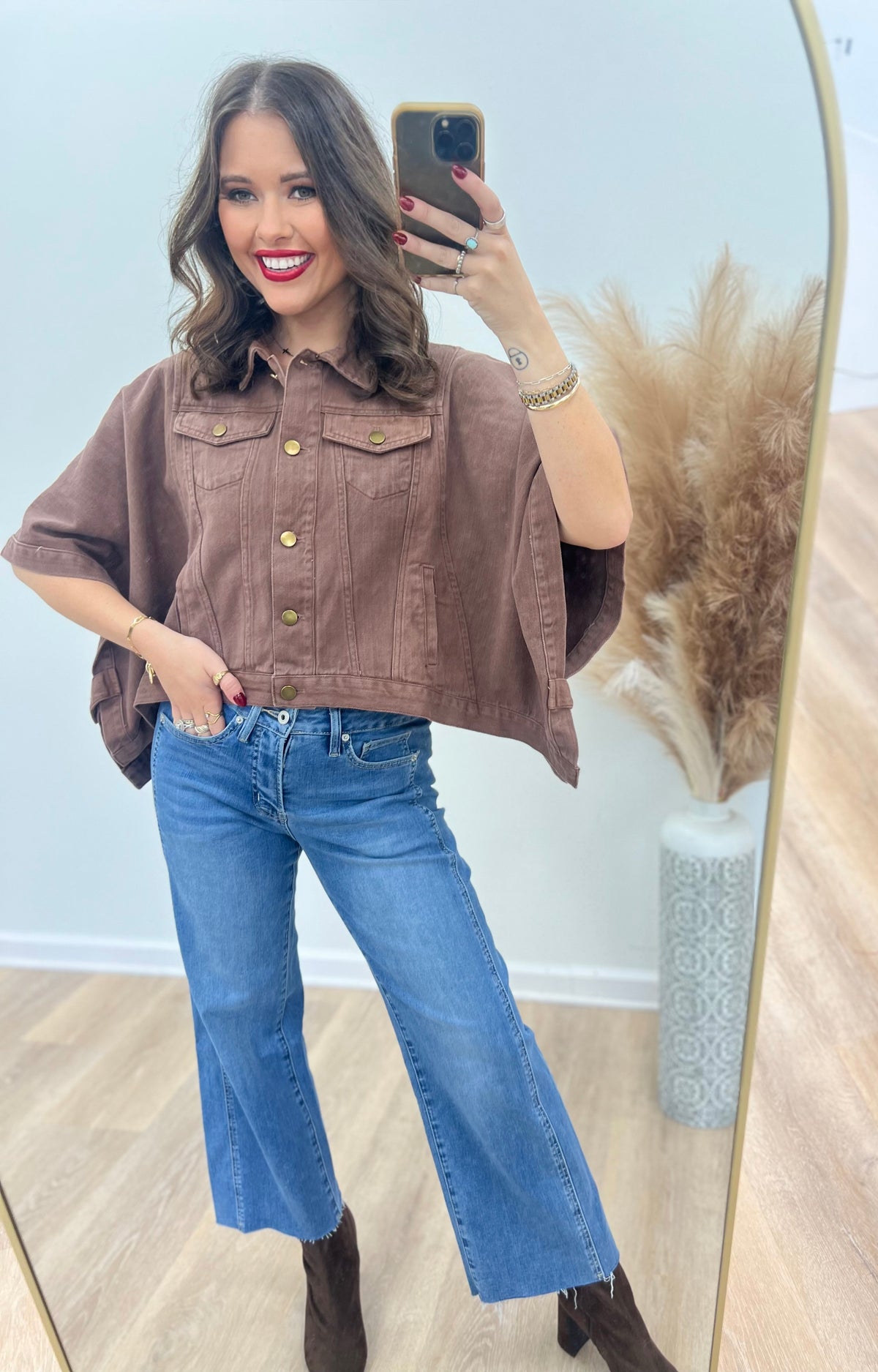 Brown short-sleeve denim jacket with snap buttons and chest flap pockets