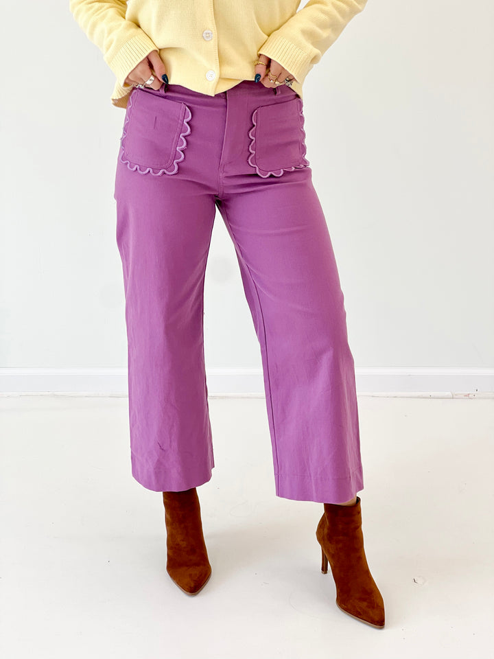 Lilac cropped wide-leg pants with scalloped front pocket detailing