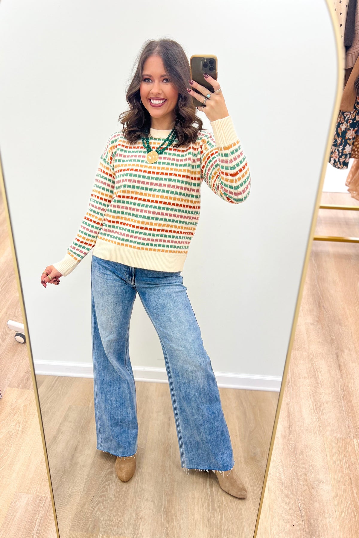 Multi-color striped sweater with cream ribbed cuffs and hem, crew neck, relaxed fit