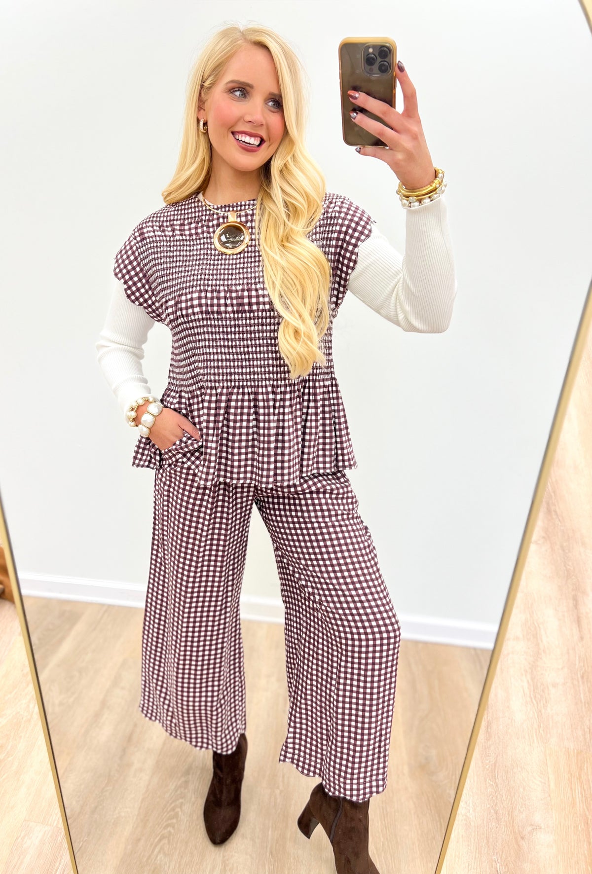 Red and white checkered wide-leg pants with smocked waist and button-front detail