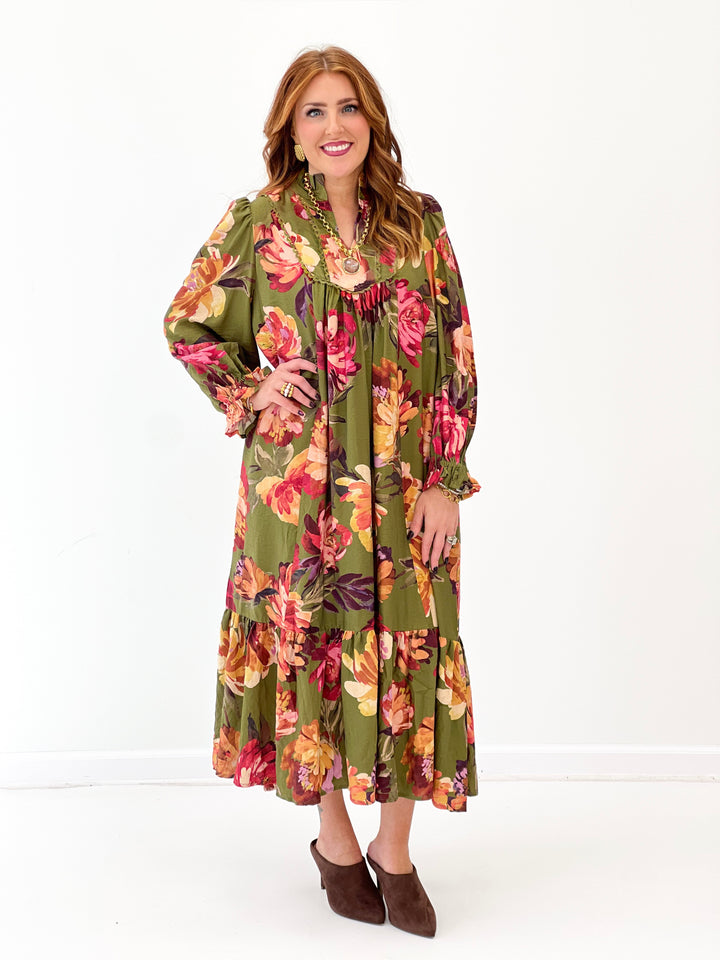 Olive floral tiered midi dress with long sleeves, tiered skirt and ruffled neckline