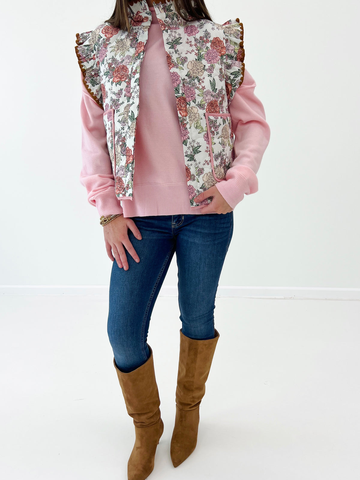 Floral ruffle sleeve vest with cream background and red floral print, open front