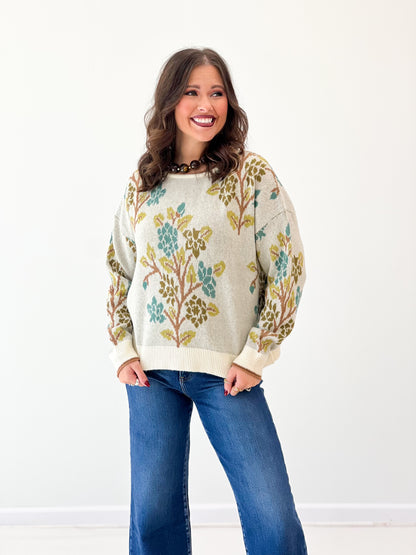 Cream knit sweater top with tree graphic print, crew neck, long sleeves, ribbed cuffs