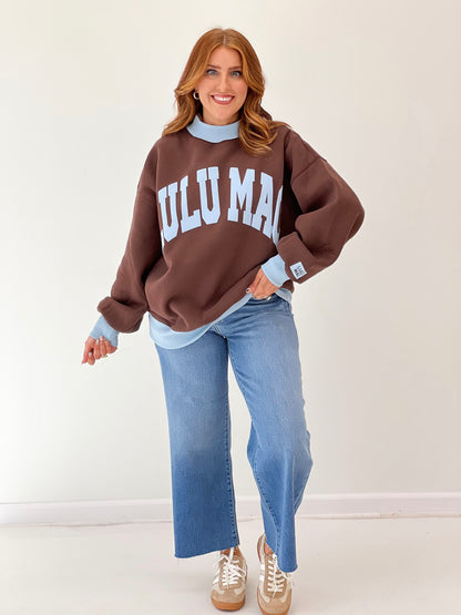 LuLu Mac brown sweatshirt with light blue mock neck, cuffs, and white “LULU MAC” print