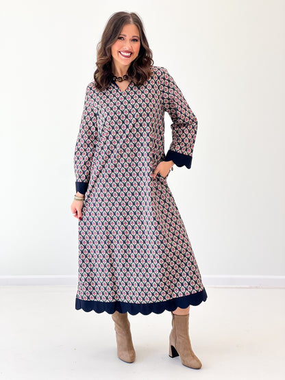 Navy floral V-neck maxi dress, standing view, long sleeves and scalloped hem