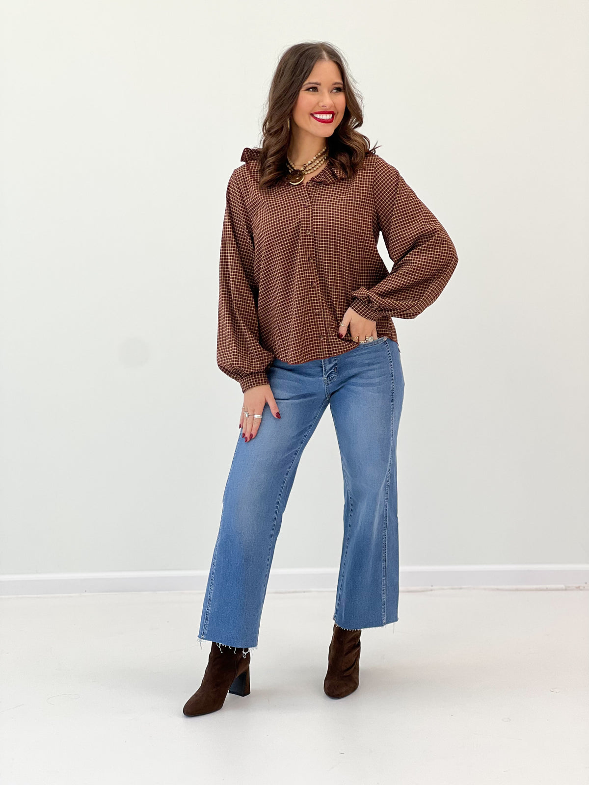 Burgundy plaid ruffle-collar blouse with long sleeves and gathered detail